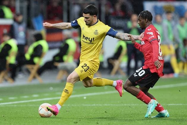 Union s Cameron Puertas Castro and Leverkusen s Jeremie Frimpong fight for the ball during a soccer game between German Bayer 04 Leverkusen and Belgian Royale Union Saint-Gilloise, the first leg game of the quarterfinals of the UEFA Europa League competition, Thursday 13 April 2023 in Leverkusen, Germany. BRUNOxFAHY  x64678306x