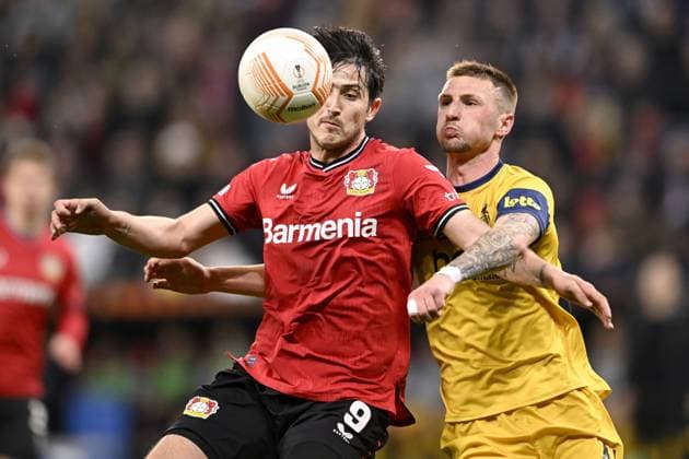 LEVERKUSEN, GERMANY - APRIL 13 : Azmoun Sardar forward of Bayer Leverkusen battles for the ball with Van Der Heyden Siebe defender of Union St-Gilloise during the UEFA Europa League Quarter-finals, 1st leg match between Leverkusen and Union SG at the BayArena on April 13, 2023 in Leverkusen, Germany, 13 04 2023 ( Leverkusen v Union SG - UEFA Europa League PhotoNews Panoramic 