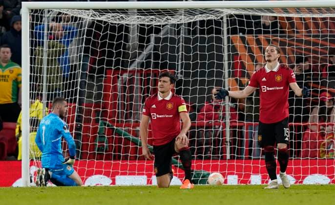 Manchester, England, 13th April 2023. Harry Maguire of Manchester United, ManU dejected after Sevilla™s second goal cannoned off his head wrong footing David De Gea of Manchester United during the UEFA Europa League match at Old Trafford, Manchester. Picture credit should read: Andrew Yates Sportimage EDITORIAL USE ONLY. No use with unauthorised audio, video, data, fixture lists, club league logos or live services. Online in-match use limited to 120 images, no video emulation. No use in betting, games or single club league player publications. SPI-2367-0075