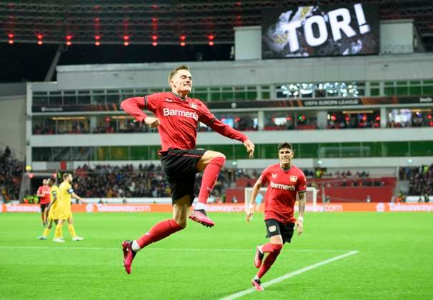Cheering Florian WIRTZ LEV after his goal to 1 1, pointing to the LEV logo on his shirt, gesture, gesture, football Europa League, quarterfinal first leg, Bayer 04 Leverkusen LEV Union Saint Gilloise USG 1 1, on 13 04 2023 in Leverkusen Germany UEFA regulations prohibit any use of photographs as image sequences and or quasi video Â