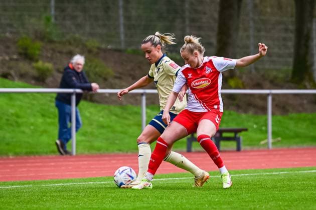 16 04 2023, GER, soccer, women, test match, 2022 2023, 1 FC Köln TSG Hoffenheim Vanessa Leimenstoll 27 TSG and Lena Uebach Köln duel for the ball Westerburg Schulstadion Rhineland Palatinate Germany.