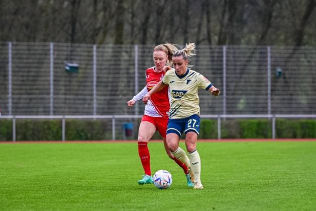 16 04 2023, GER, soccer, women, test match, 2022 2023, 1 FC Köln TSG Hoffenheim Vanessa Leimenstoll 27 TSG and Sarah Puntigam Köln duel for the ball Westerburg Schulstadion Rhineland Palatinate Germany.
