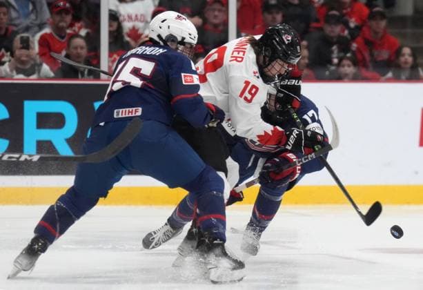 April 16, 2023, Brampton, ON, CANADA: Canada forward Brianne Jenner (19) battles USA defender Savannah Harmon (15) for the puck during first period IHF Women s World Hockey Championship hockey action in Brampton, Ont., on Sunday, April 16, 2023. Canada News - April 16, 2023  - ZUMAc35_ 20230416_zaf_c35_075 Copyright: xNathanxDenettex