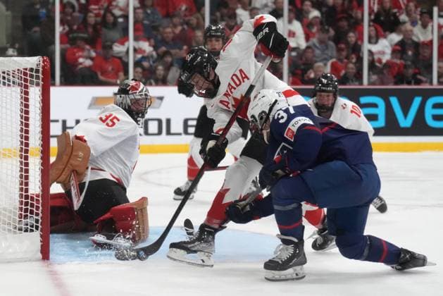 April 16, 2023, Brampton, ON, CANADA: Canada defender Renata Fast (14) battles against USA forward Abbey Murphy (37) in front of Canada goaltender Ann-Renee Desbiens (35) during second period IHF Women s World Hockey Championship gold metal hockey action in Brampton, Ont., on Sunday, April 16, 2023. Canada News - April 16, 2023  - ZUMAc35_ 20230416_zaf_c35_090 Copyright: xNathanxDenettex