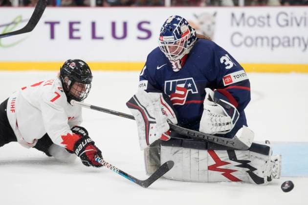 April 16, 2023, Brampton, ON, CANADA: USA goaltender Aerin Frankel (31) makes a save s Canada defender Ella Shelton (17) tries to reach the puck during second period IHF Women s World Hockey Championship gold medal hockey action in Brampton, Ont., on Sunday, April 16, 2023. Canada News - April 16, 2023  - ZUMAc35_ 20230416_zaf_c35_100 Copyright: xFrankxGunnx