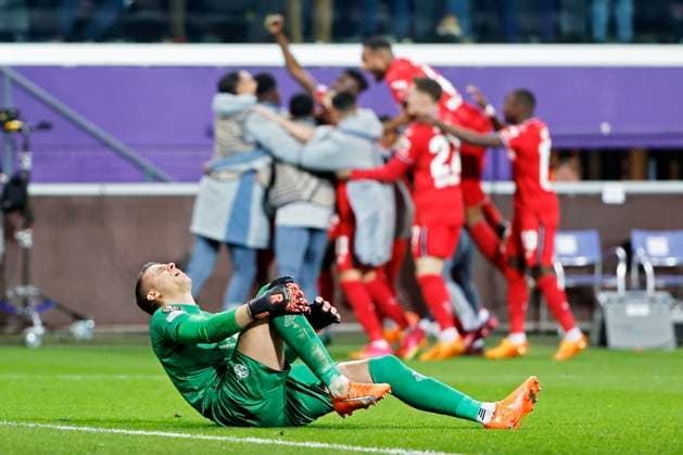 ANDERLECHT, BELGIUM - APRIL 20 : Moris Anthony goalkeeper of Union St-Gilloise looks dejected when Frimpong Jeremie defender of Bayer Leverkusen celebrates during the UEFA Europa League Quarter-finals, 2nd leg match between Union SG and Bayer Leverkusen at the Anderlecht stadium on April 20, 2023 in Anderlecht, Belgium, 20 04 2023 ( Union SG v Bayer Leverkusen - UEFA Europa League PhotoNews Panoramic 
