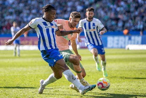 Berlin, 22 04 2023, Football, Bundesliga, 29 Matchday, Hertha BSC SV Werder Bremen, Olympiastadion Berlins Jessic Ngankam l scores against Niklas Stark of Werder Bremen to 1 4 DFL regulations and DFB regulations prohibit any use of photographs as image sequences and or quasi video, Foto Andreas Gora Hertha BSC Werder Bremen
