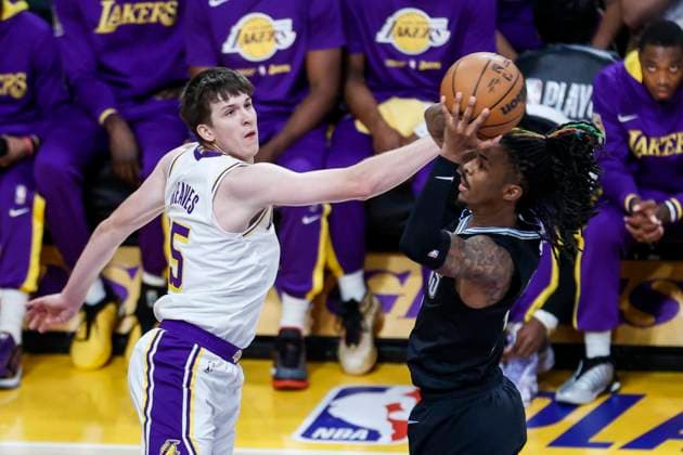 April 22, 2023, Los Angeles, California, USA: Memphis Grizzlies guard Ja Morant (12) goes to the basket under pressure from Los Angeles Lakers guard Austin Reaves (15) during an NBA, Basketball Herren, USA basketball playoffs round one game 3 Saturday, April 22, 2023, in Los Angeles. Los Angeles USA - ZUMAc68_ 20230422_zaf_c68_089 Copyright: xRingoxChiux