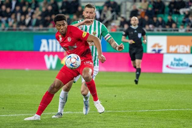 SOCCER - BL, Rapid vs RBS VIENNA,AUSTRIA,26.APR.23 - SOCCER - ADMIRAL Bundesliga, championship group, SK Rapid Wien vs Red Bull Salzburg. Image shows Bernardo Fernandes da Silva Junior (RBS) and Guido Burgstaller (Rapid).  GEPAxpictures xPhilippxBrem