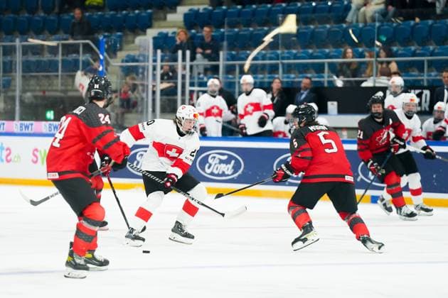 27 04 2023, Basel, St Jakob Arena, IIHF Ice Hockey U18 World Championship Canada vs Switzerland, 20 Matteo Wagner Switzerland against 5 Etienne Morin Canada Basel St Jakob Arena Basel Switzerland  Copyright: xJustPictures.ch DanielaxPorcellix