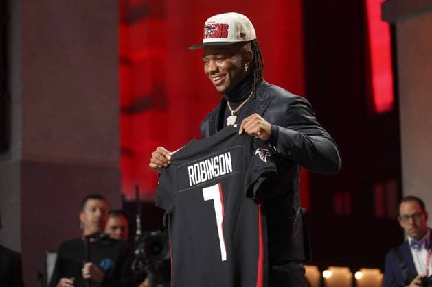 Bijan Robinson poses for a photo after being selected by the Atlanta Falcons during the first round of the NFL, American Football Herren, USA Draft at Union Station in Kansas City, Missouri on Thursday, April 27, 2023.  KCP20230427199 KYLExRIVAS
