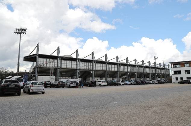 Unterhaching, Germany 29 April 2023 Football, Men, Season 2022 2023, SpVgg Unterhaching Türkgücü Munich, Regionalliga Bayern, Stadion am Sportpark Here is the view of the Alpenbauer Sportpark, Stadion am Sportpark in Unterhaching, home ground of SpVgg Unterhaching, back view of the back straight, outside view,parking lot.