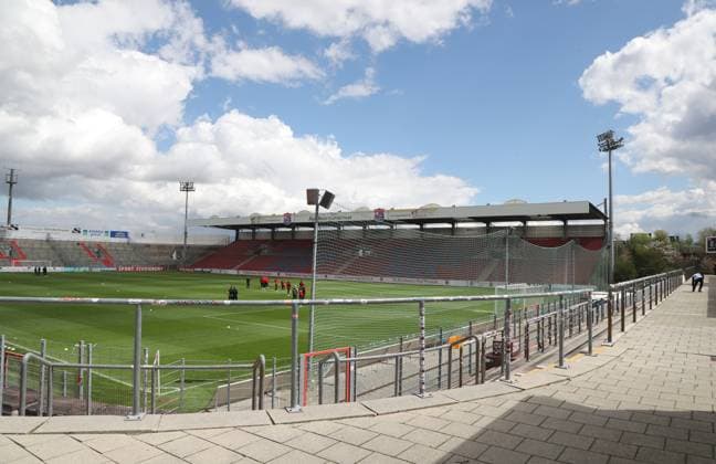 Unterhaching, Germany 29 April 2023 Football, Men, Season 2022 2023, SpVgg Unterhaching Türkgücü Munich, Regionalliga Bayern, Stadion am Sportpark Here the view of the Alpenbauer Sportpark, Stadion am Sportpark in Unterhaching, home ground of SpVgg Unterhaching, view from the south stand,Ultras to the pitch and back straight, east stand.