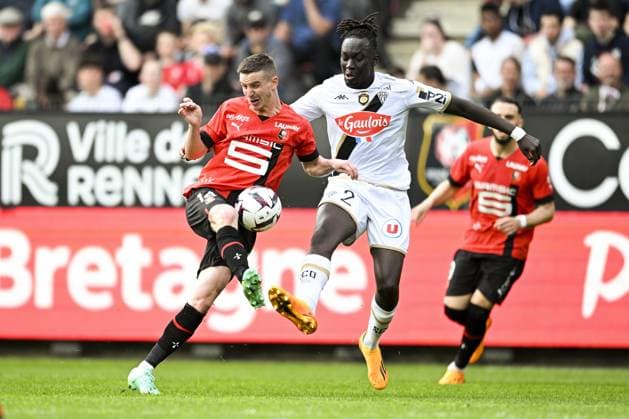 Benjamin Bourigeaud (Rennes FC) vs Batista Mendy (Angers) FOOTBALL : Rennes vs Angers - Ligue 1 - 30 04 2023 JBAutissier Panoramic 