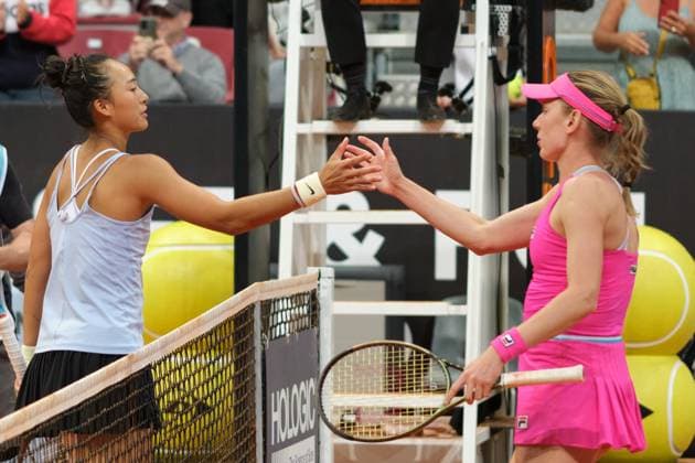 (230501) -- MADRID, May 1, 2023 -- Zheng Qinwen (L) of China greets Ekaterina Alexandrova of Russia after their women s singles round of 32 match at the Madrid Open tennis tournament in Madrid, Spain, April 30, 2023. ) (SP)SPAIN-MADRID-TENNIS-MADRID OPEN-WOMEN S SINGLES MengxDingbo 