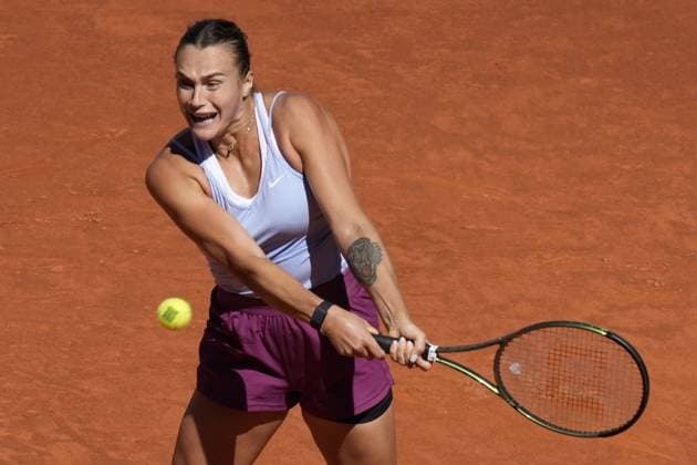 Aryna Sabalenka of Belarus returns a shot to Maria Sakkari of Greece during their semi-final match of the Mutua Madrid Open at the Caja Magica stadium, in Madrid, Spain, on Thursday, May 4, 2023.  PDH20230504061 PaulxHanna