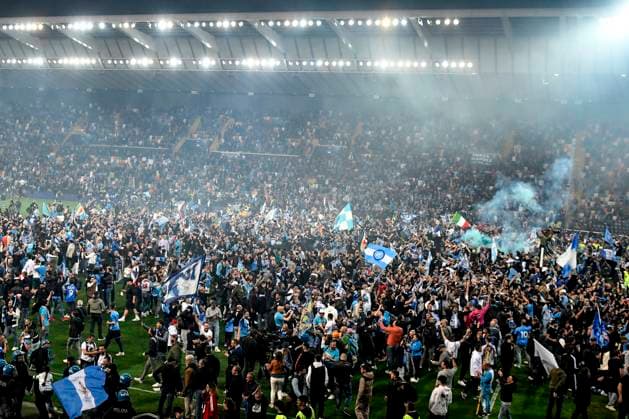 Napoli fans invade the pitch at the end of the Serie A football match between Udinese Calcio and SSC Napoli at Friuli stadium in Udine (Italy), May 4th, 2023. Napoli is Italian champion for the third time in its history. andreaxstaccioli