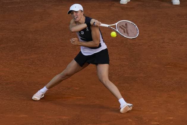 Iga Swiatek of Poland returns a shot to Aryna Sabalenka of Belarus during the final of the 2023 Mutua Madrid Open at the Caja Magica stadium, in Madrid, Spain, on Saturday, May 6, 2023.  PDH20230506005 PaulxHanna