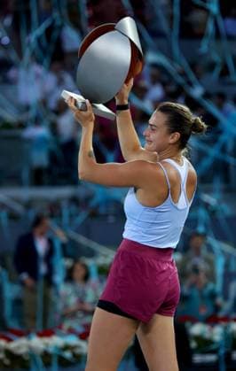 Mandatory Credit: Photo by Ella Ling Shutterstock (13895885b) Aryna Sabalenka of Belarus celebrates with the trophy under the blue streamer Mutua Madrid Open, Day 13, Tennis, La Caja Magica, Madrid, Spain - 06 May 2023 Mutua Madrid Open, Day 13, Tennis, La Caja Magica, Madrid, Spain - 06 May 2023 Copyright: xEllaxLing Shutterstockx 13895885b