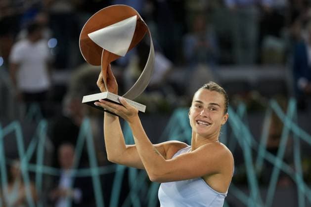 Aryna Sabalenka of Belarus holds her trophy on the podium after winning the 2023 Mutua Madrid Open against Iga Swiatek of Poland at the Caja Magica stadium, in Madrid, Spain, on Saturday, May 6, 2023.  PDH20230506011 PaulxHanna