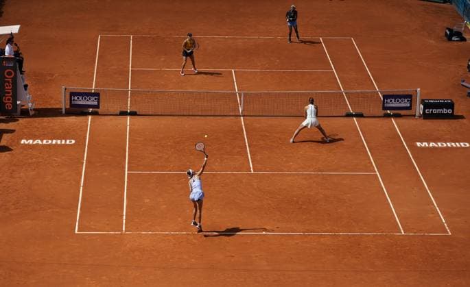 Doubles pair Victoria Azarenka of Belarus (Bottom L) and Beatriz Haddad Maia of Brazil serve against Jessica Pegula (Top L) and Coco Gauff of the U.S. during the doubles final in the Mutua Madrid Open at the Caja Magica stadium, in Madrid, Spain, on Sunday, May 7, 2023.  PDH20230507004 PaulxHanna