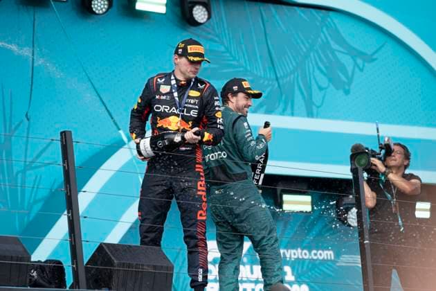 May 7, 2023, Miami, Florida, United States: FERNANDO ALONSO (SPA) of Aston Martin 14 celebrates finishing P3 on the podium (right) along with winner MAX VERSTAPPEN (NED) of Red Bull Racing 1 (left)..Max Verstappen won the Formula 1 Crypto.com Miami Grand Prix after besting teammate Sergio Perez, who finished second. Fernando Alonso of Aston Martin made the podium, finishing P3...Red Bull Oracle Racing s Max Verstappen maintains his dominance over the 2023 season. Motorsports, open wheel racing, Liberty Media, F1. Miami United States - ZUMAb177 20230507_zap_b177_054 Copyright: xTaidghxBarronx