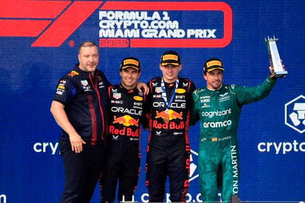 MIAMI GARDENS, FL - MAY 07: Oracle Red Bull Racing driver Sergio Perez 11 , Oracle Red Bull Racing Honda driver Max Verstappen 1 and Aston Martin Aramco Cognizzant driver Fernando Alonzo 14 on the podium after the running of the Formula 1 Crypto.com Miami Grand Prix at Miami International Autodrome in Miami Gardens, FL. (Photo by Jeff Robinson Icon Sportswire) AUTO: MAY 07 F1 Crypto.com Miami Grand Prix EDITORIAL USE ONLY Icon23050748361