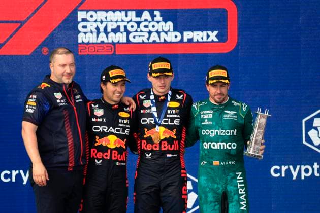 MIAMI GARDENS, FL - MAY 07: Oracle Red Bull Racing driver Sergio Perez 11 , Oracle Red Bull Racing Honda driver Max Verstappen 1 and Aston Martin Aramco Cognizzant driver Fernando Alonzo 14 on the podium after the running of the Formula 1 Crypto.com Miami Grand Prix at Miami International Autodrome in Miami Gardens, FL. (Photo by Jeff Robinson Icon Sportswire) AUTO: MAY 07 F1 Crypto.com Miami Grand Prix EDITORIAL USE ONLY Icon23050748461