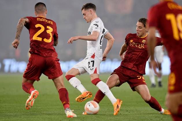 Florian Wirtz of Bayer Leverkusen, Gianluca Mancini and Edoardo Bove of AS Roma during the Europa League football match between AS Roma and Bayer Leverkusen at Olimpico stadium in Rome (Italy), May 11th, 2023. antoniettaxbaldassarre