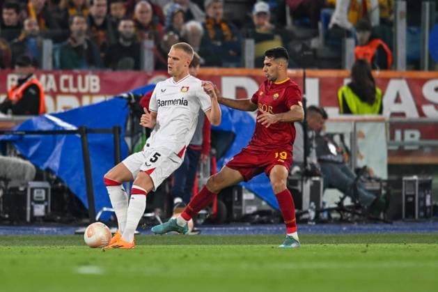 Bayer LeverkusenÃ¢& x80;& x99;s Mitchel Bakker defending ball from AS RomaÃ¢& x80;& x99;s Mehmet Zeki o& x87;elik during semifinal Europe League soccer match between AS Roma vs. Bayern Leverkusen at the Olimpico stadium in Rome, Italy, 11th of May 2023  Copyright: xVinnyxOrlando LiveMediax xipa-agx xLivexMediax 0 IPA_IPA37877915
