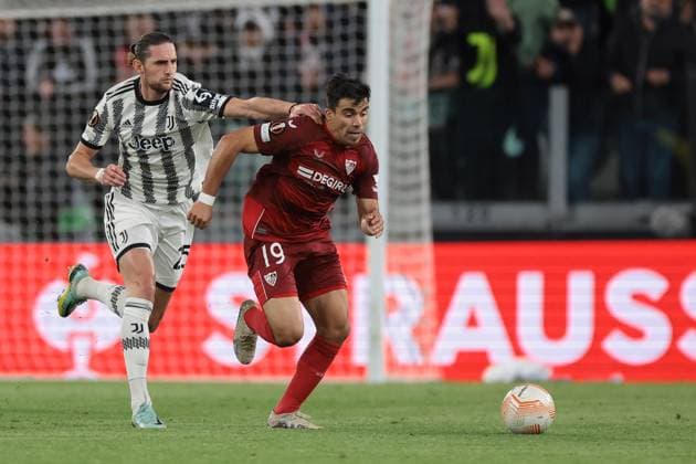 Turin, Italy, 11th May 2023. Adrien Rabiot of Juventus tussles with Marcos Acuna of Sevilla during the UEFA Europa League match at Allianz Stadium, Turin. Picture credit should read: Jonathan Moscrop Sportimage EDITORIAL USE ONLY. No use with unauthorised audio, video, data, fixture lists, club league logos or live services. Online in-match use limited to 120 images, no video emulation. No use in betting, games or single club league player publications. SPI-2435-0033