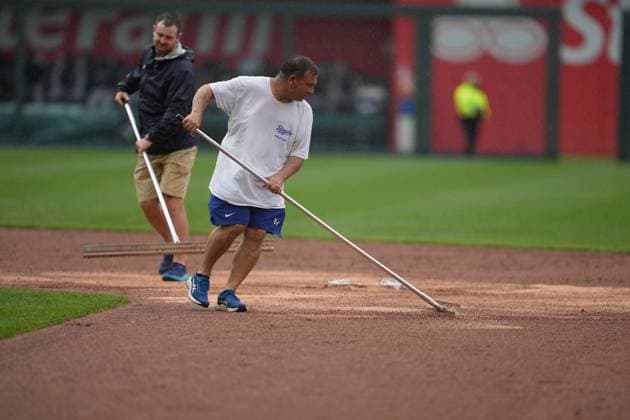 MAY 11, 2023: The grounds crew worked tirelessly all day as the rain continued to fall at Kauffman Stadium Kansas City, Missouri. CSM. Kansas City United States - ZUMAc04_ 20230511_zaf_c04_013 Copyright: xJonxRobichaudx