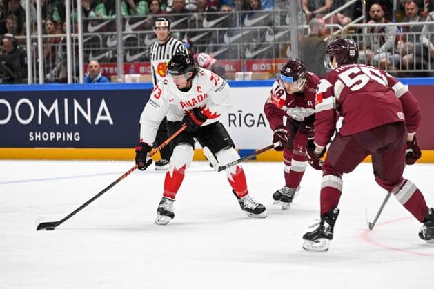 RIGA, LATVIA MAY 12 Tyler Toffoli of Canada controls the puck against Rodrigo Abols R of Latvia during the 2023 IIHF Ice Hockey World Championship Finland Latvia game between Latvia and Canada at Arena Riga on May 12, 2023 in Riga, Latvia Riga Arena Riga Latvia  Copyright: xJustPictures.ch AndreaxBrancax