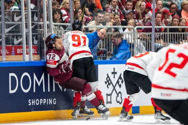 RIGA, LATVIA MAY 12 Adam Fantilli of Canada R hit on Janis Jaks of Latvia L during the 2023 IIHF Ice Hockey World Championship Finland Latvia game between Latvia and Canada at Arena Riga on May 12, 2023 in Riga, Latvia Riga Arena Riga Latvia  Copyright: xJustPictures.ch JarixPestelaccix