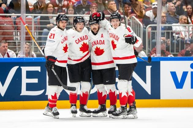 RIGA, LATVIA MAY 12 MacKenzie Weegar of Canada 2nd from R celebrated for his goal by Cody Glass of Canada R , Scott Laughton of Canada L Jack Quinn of Canada 2nd from L during the 2023 IIHF Ice Hockey World Championship Finland Latvia game between Latvia and Canada at Arena Riga on May 12, 2023 in Riga, Latvia Riga Arena Riga Latvia  Copyright: xJustPictures.ch JarixPestelaccix