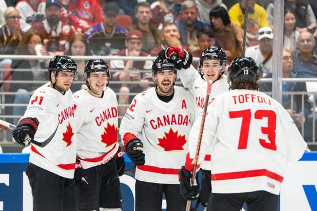 RIGA, LATVIA MAY 12 MacKenzie Weegar of Canada C celebrated for his goal by Cody Glass of Canada 2nd from R , Scott Laughton of Canada L Jack Quinn of Canada 2nd from L and Tyler Toffoli of Canada R during the 2023 IIHF Ice Hockey World Championship Finland Latvia game between Latvia and Canada at Arena Riga on May 12, 2023 in Riga, Latvia Riga Arena Riga Latvia  Copyright: xJustPictures.ch JarixPestelaccix