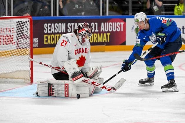 RIGA, LATVIA MAY 14 Jan Drozg of Slovenia tries to score against goalkeeper Devon Levi of Canada during the 2023 IIHF Ice Hockey World Championship Finland Latvia game between Slovenia and Canada at Arena Riga on May 14, 2023 in Riga, Latvia Riga Arena Riga Latvia  Copyright: xJustPictures.ch AndreaxBrancax