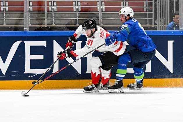 RIGA, LATVIA MAY 14 Adam Fantilli of Canada protects the puck against Ziga Jeglic of Slovenia during the 2023 IIHF Ice Hockey World Championship Finland Latvia game between Slovenia and Canada at Arena Riga on May 14, 2023 in Riga, Latvia Riga Arena Riga Latvia  Copyright: xJustPictures.ch AndreaxBrancax