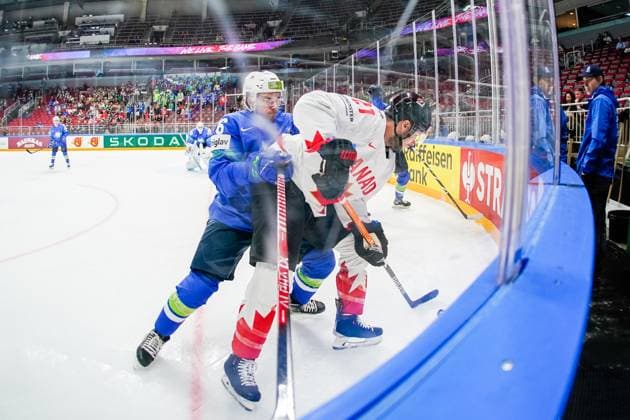 RIGA, LATVIA MAY 14 Bine Masic of Slovenia L try to stop Scott Laughton of Canada R during the 2023 IIHF Ice Hockey World Championship Finland Latvia game between Slovenia and Canada at Arena Riga on May 14, 2023 in Riga, Latvia Riga Arena Riga Latvia  Copyright: xJustPictures.ch JarixPestelaccix