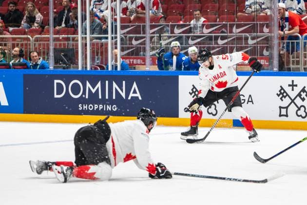 RIGA, LATVIA MAY 14 MacKenzie Weegar of Canada R stopping a flying puck at the blue line during the 2023 IIHF Ice Hockey World Championship Finland Latvia game between Slovenia and Canada at Arena Riga on May 14, 2023 in Riga, Latvia Riga Arena Riga Latvia  Copyright: xJustPictures.ch JarixPestelaccix