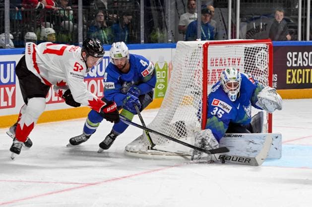 RIGA, LATVIA MAY 14 Tyler Myers of Canada tries to score against Aleksandar Magovac of Slovenia L and goalkeeper Luka Gracnar of Slovenia R during the 2023 IIHF Ice Hockey World Championship Finland Latvia game between Slovenia and Canada at Arena Riga on May 14, 2023 in Riga, Latvia Riga Arena Riga Latvia  Copyright: xJustPictures.ch AndreaxBrancax