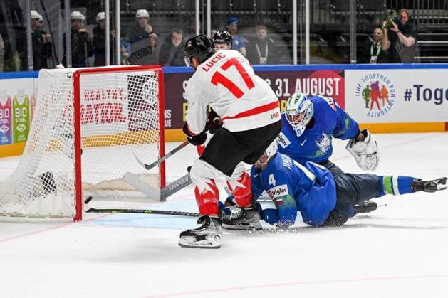 RIGA, LATVIA MAY 14 Aleksandar Magovac of Slovenia saves the puck against Milan Lucic of Canada during the 2023 IIHF Ice Hockey World Championship Finland Latvia game between Slovenia and Canada at Arena Riga on May 14, 2023 in Riga, Latvia Riga Arena Riga Latvia  Copyright: xJustPictures.ch AndreaxBrancax