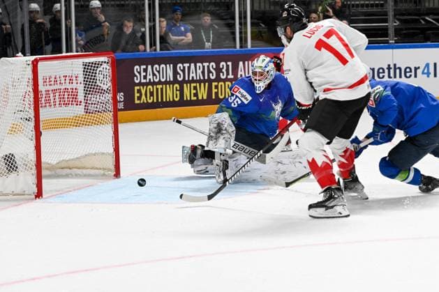 RIGA, LATVIA MAY 14 goalkeeper Luka Gracnar of Slovenia and Milan Lucic of Canada watches the puck during the 2023 IIHF Ice Hockey World Championship Finland Latvia game between Slovenia and Canada at Arena Riga on May 14, 2023 in Riga, Latvia Riga Arena Riga Latvia  Copyright: xJustPictures.ch AndreaxBrancax