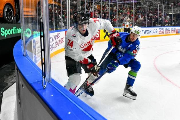 RIGA, LATVIA MAY 14 Ethan Bear of Canada protects the puck along the board against Jan Urbas of Slovenia during the 2023 IIHF Ice Hockey World Championship Finland Latvia game between Slovenia and Canada at Arena Riga on May 14, 2023 in Riga, Latvia Riga Arena Riga Latvia  Copyright: xJustPictures.ch AndreaxBrancax