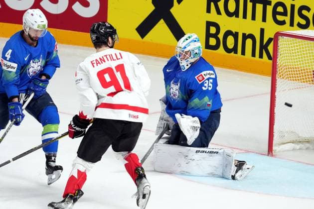 (230515) -- RIGA, May 15, 2023 -- Slovenia s goalkeeper Luka Gracnar (R) tries to make a save during the Group B match between Slovenia and Canada at the 2023 IIHF Ice hockey, Eishockey World Championship, WM, Weltmeisterschaft in Riga, Latvia, May 14, 2023. (Photo by Xinhua) (SP)LATVIA-RIGA-2023 IIHF ICE HOCKEY WORLD CHAMPIONSHIP-CANADA VS SLOVENIA EdijsxPalens 
