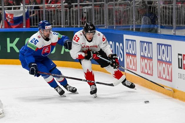 RIGA, LATVIA MAY 15 Jake Neighbours of Canada fights for the puck possession against Alex Tamasi of Slovakia during the 2023 IIHF Ice Hockey World Championship Finland Latvia game between Slovakia and Canada at Arena Riga on May 15, 2023 in Riga, Latvia Riga Arena Riga Latvia  Copyright: xJustPictures.ch AndreaxBrancax