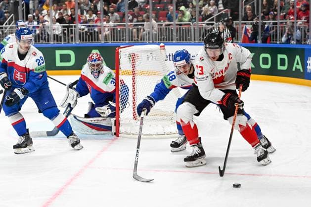 RIGA, LATVIA MAY 15 Tyler Toffoli of Canada protects the puck against Viliam Cacho of Slovakia during the 2023 IIHF Ice Hockey World Championship Finland Latvia game between Slovakia and Canada at Arena Riga on May 15, 2023 in Riga, Latvia Riga Arena Riga Latvia  Copyright: xJustPictures.ch AndreaxBrancax