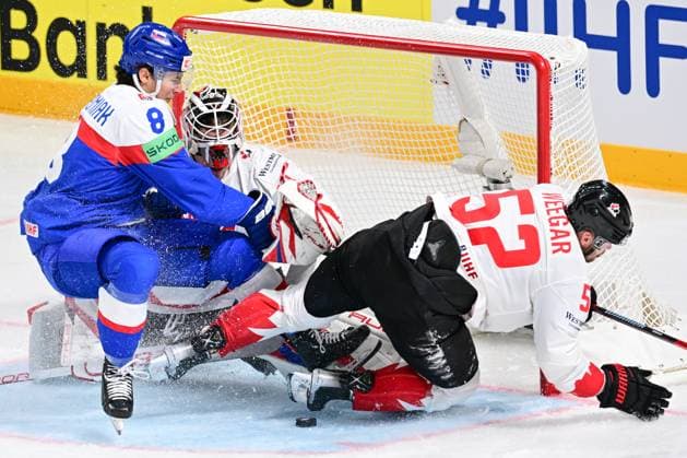 L-R Martin Chromiak (SVK), goalkeeper Samuel Montembeault (CAN) and MacKenzie Weegar (CAN) in action during the IIHF Ice hockey, Eishockey World Championship, WM, Weltmeisterschaft Group B match Slovakia vs Canada, on May 15, 2023, in Riga, Latvia. (CTKxPhoto DavidxTanecek) CTKPhotoP2023051506704  CTKPhotoP2023051506704