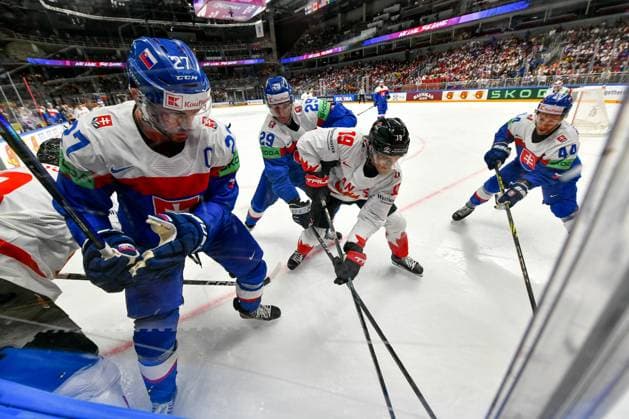 RIGA, LATVIA MAY 15 Peyton Krebs of Canada fights for the puck against Marek Hrivik of Slovakia, Michal Ivan of Slovakia and Mislav Rosandic of Slovakia during the 2023 IIHF Ice Hockey World Championship Finland Latvia game between Slovakia and Canada at Arena Riga on May 15, 2023 in Riga, Latvia Riga Arena Riga Latvia  Copyright: xJustPictures.ch AndreaxBrancax
