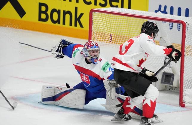 (230516) -- RIGA, May 16, 2023 -- Slovakia s goalkeeper Samuel Hlavaj (L) tries to make a save during the Group B match between Canada and Slovakia at the 2023 IIHF Ice hockey, Eishockey World Championship, WM, Weltmeisterschaft in Riga, Latvia, May 15, 2023. (Photo by Xinhua) (SP)LATVIA-RIGA-2023 IIHF ICE HOCKEY WORLD CHAMPIONSHIP-CANADA VS SLOVAKIA EdijsxPalens 